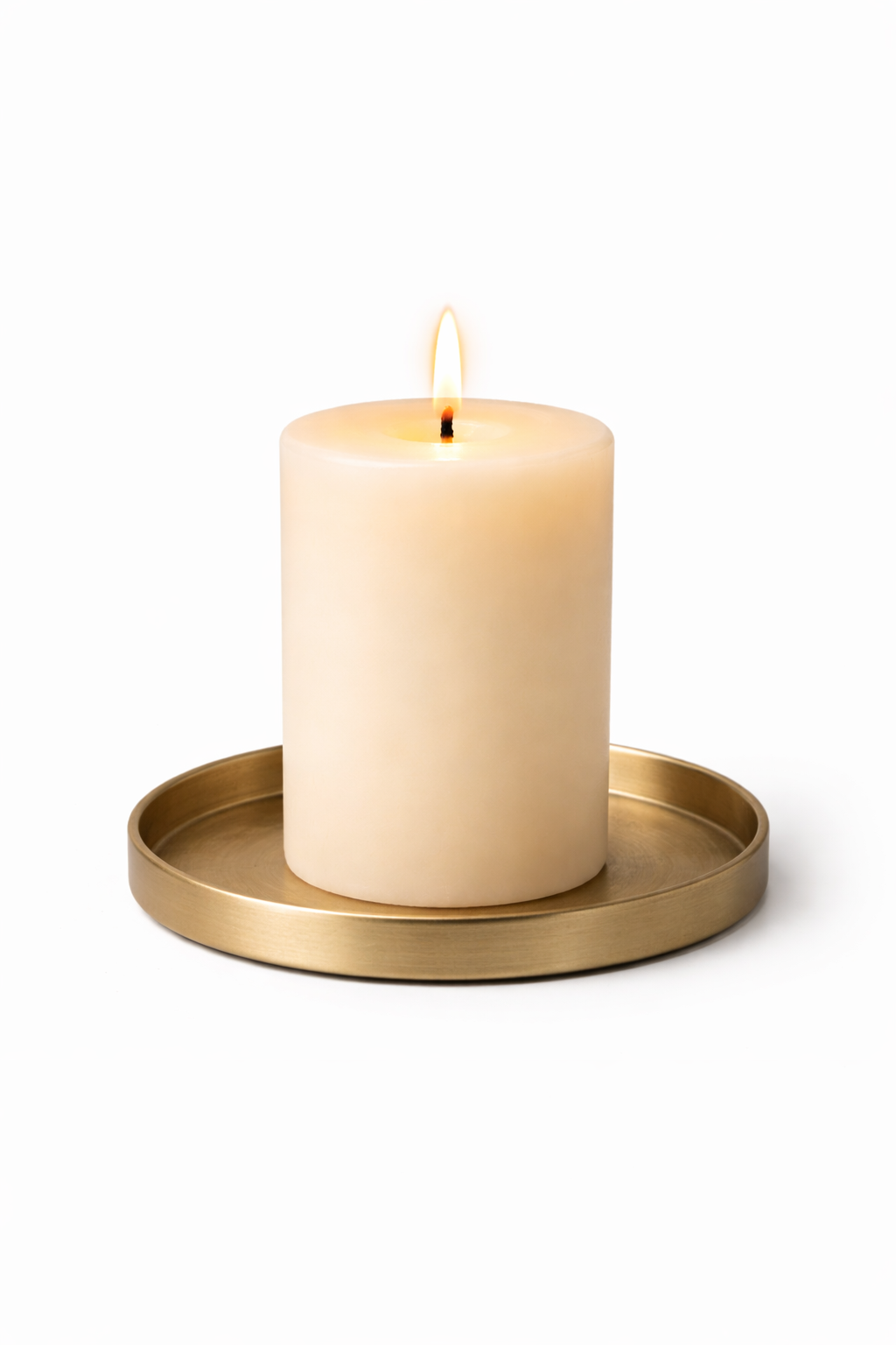 Warm candle on brass tray